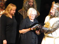 Mrs. Reinhart recieving a plaque after Jerry's Passing
